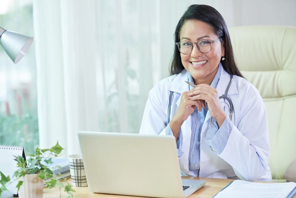Healthcare professional seated at a desk